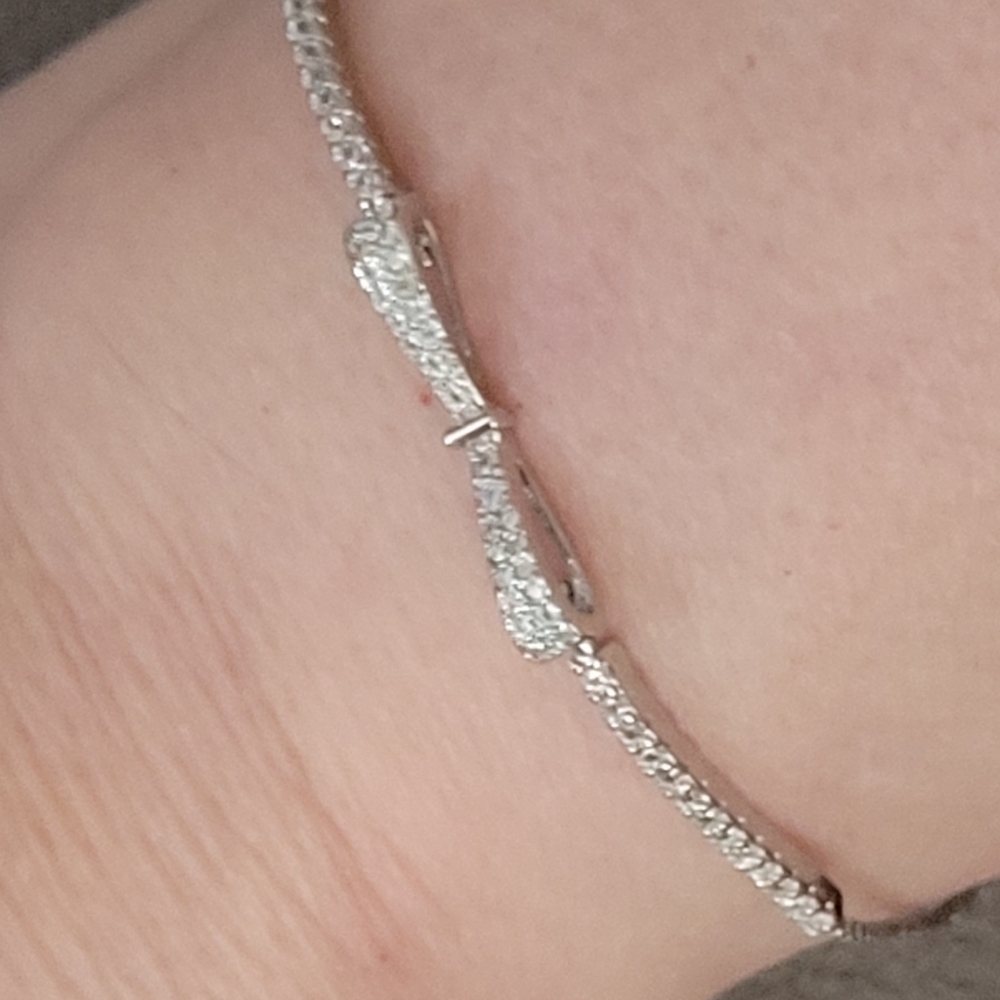 Unmarked metal paired w clear zircons